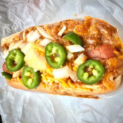 Yummy Chili-cheese dog w/ fresh jalapeño & onion.