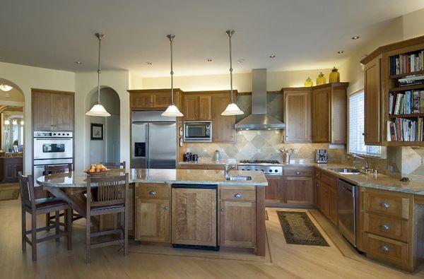 Newly installed pendant lighting in a recently remodeled kitchen