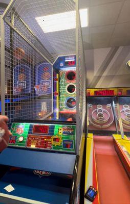 You can see 3 different games : basketball, nfl football, skeeball