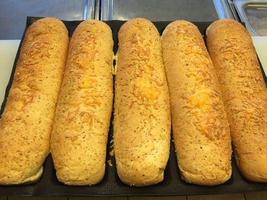 Delicious fresh bread, including #1 seller, Italian Herbs and cheese.