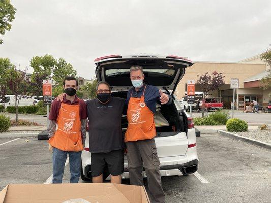 Left to Right: Justin, "Tony the Happy Customer", Thomas And my shed pieces that now fit in my SUV!