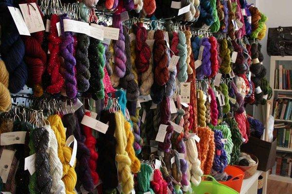 Visit the famous Wall of Yarn, with nearly a thousand skeins of luxury yarn at your fingertips!