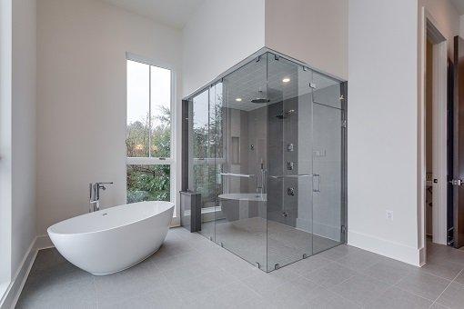 Frameless glass steam shower enlcosure in Fairfax, VA in a home built by ASTA Homes.