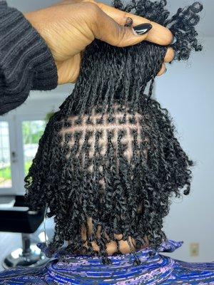 Microlocs twist with own hair