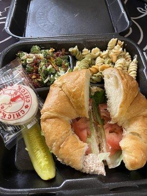 Barbie-Q chicken salad on a croissant with a side of pasta salad & broccoli salad