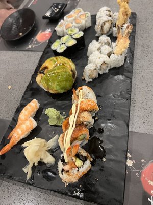 Spicy tuna roll, avocado ball, and assorted sushi