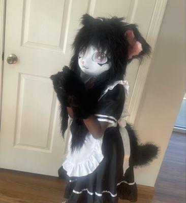 A thrilled Furry poses in her custom fitted costume by Owner Sheila