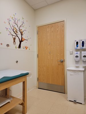 Inside a patient room. Friendly monkeys on the wall.