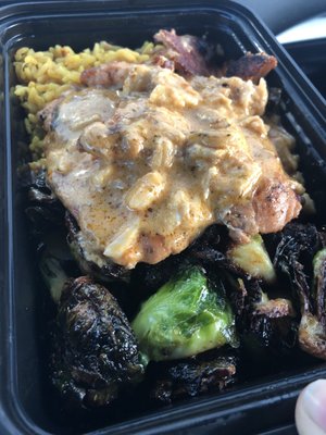 Lump crab topped blackened salmon w/ flash fried brussel sprouts and saffron rice.