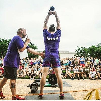 Demoing the kettlebell swing for a group of competitors.