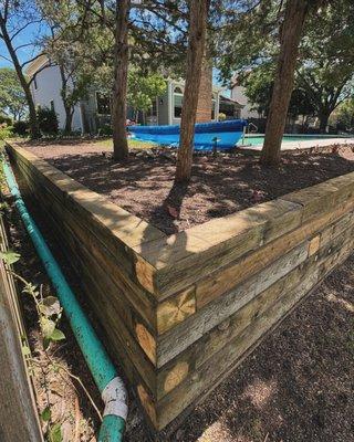 Here we installed a 6x8x8 timber retaining wall after the previous wall began to fail.