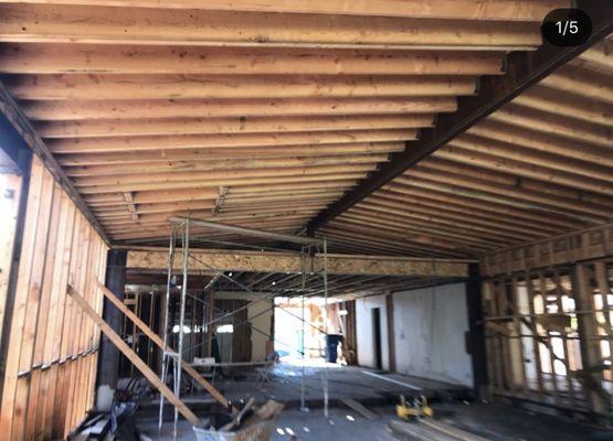 Interior framing of an addition to existing home. Structural steel beams and columns were installed.