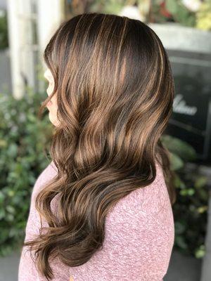 Caramel highlights to brighten and accent her natural color