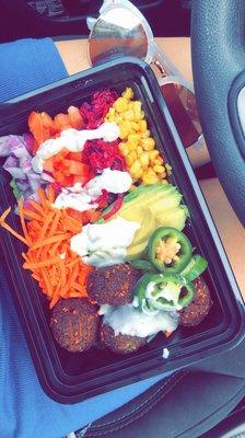 CYO bowl- greens, corn, cucumber, avocado, tomato, red onion, red cabbage, falafel and verde and cucumber sauce