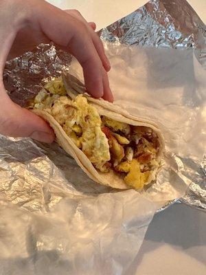 Egg and bacon breakfast taco.