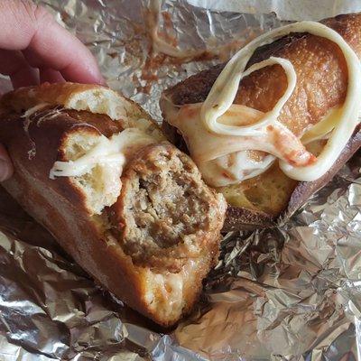 Juicy meatballs and creamy cheese on Artisan bread