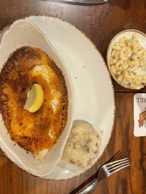 Baked fish with mashed potatoes and macaroni salad.