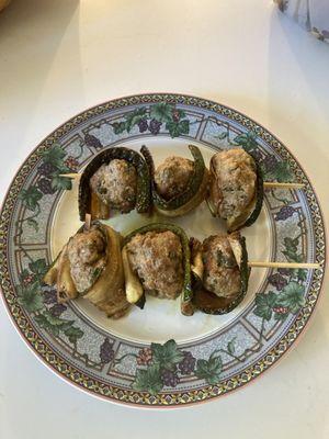 Your zucchini, fried and marinated, wrapped around my veal meatballs with lemon, capers, parsley, and Parmigiano Reggiano.