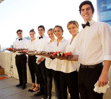 Our servers with some delicious vegetarian appetizers!