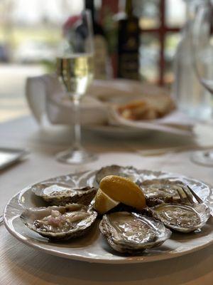 Oysters served with shallots and passionfruit.