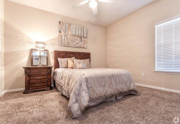 Bedroom area at The Falls at Borough Park apartments in Spring, Texas.