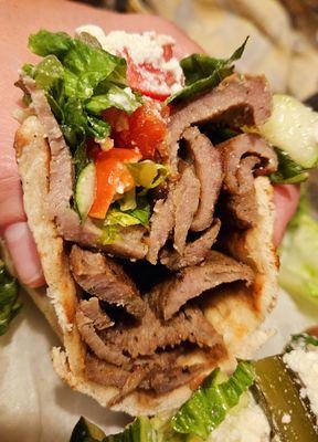 Stacks of gyro in their sandwich