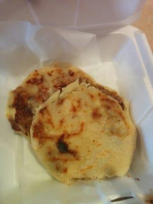 Corn tortilla filled with cheese rind pork or mixed beans.