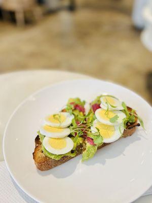 Avocado toast with a boiled egg