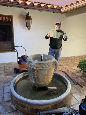 Ben and my newly repaired fountain!