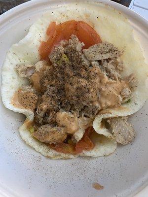 Breakfast bowl with egg white, chicken steak, veggies, and chipotle.