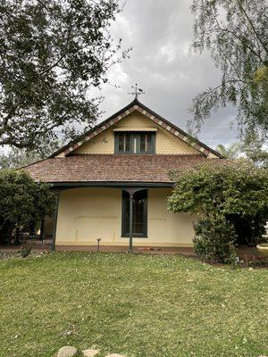 Part adobe, wood siding and shingles. Special techniques and paint to preserve the adobe.