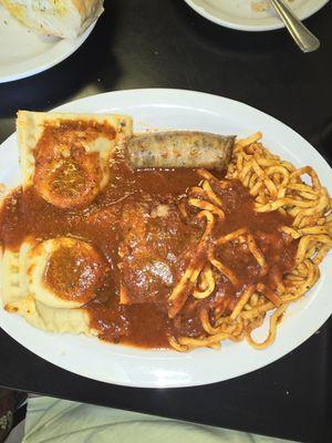 Spaghetti with huge raviolis, sausage and meatballs