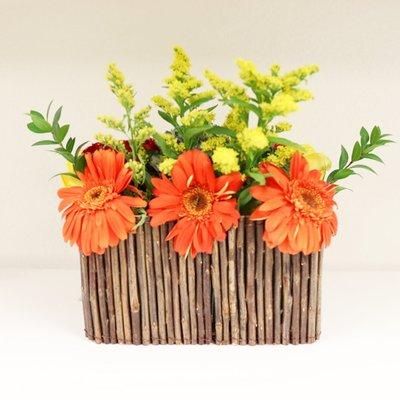 Medium size, spring flowers, entrance or reception desk flower arrangement.