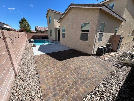 Elegant transformation achieved with pavers, giving this satisfied customer's back patio a sophisticated and stylish finish.