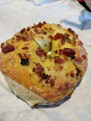 Bacon and cheddar bagel with cream cheese