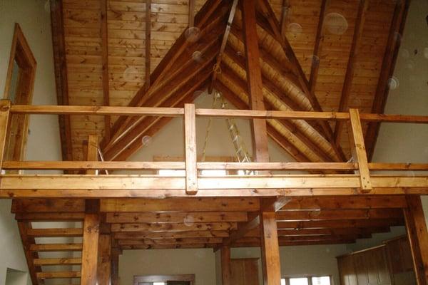 Finished results of tongue & groove ceiling & banister after interior staining of Highlands, NC home