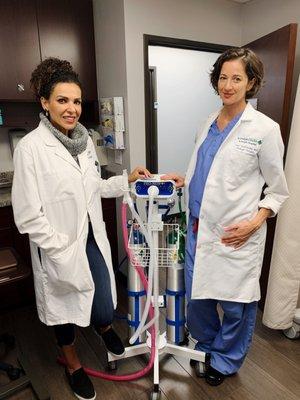 Dr. Gabal and Dr. Trofimenko posing with Pro-Nox. The Pro-Nox Nitrous Oxide Delivery System empowers you to safely control your pain relief.