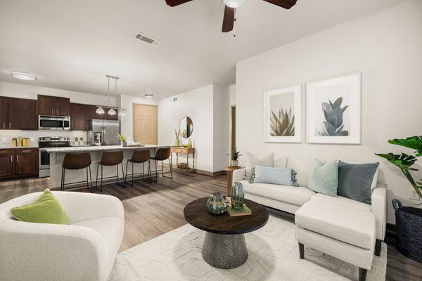 Living room with view of kitchen at Estates of Richardson