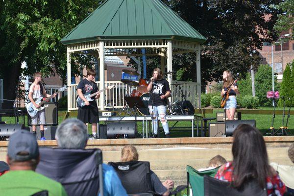 A picture of our students performing in Foster Park at our Annual Rhum Fest Concert!