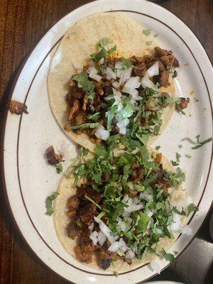 Alpastor tacos with onion & cilantro