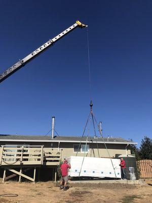 Dropping the Swim spa into place next to the deck