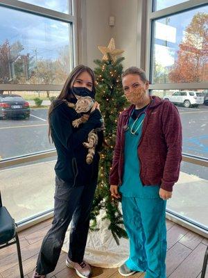 2 of our staff members pose for a Christmas picture.