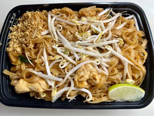 Chicken Pad Thai - Wide rice noodles served with bean sprouts, scallion, and egg, topped with roasted peanuts