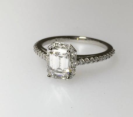 Beautiful Platinum ring with 1 carat diamond center and diamonds on the side.  Very Happy client.