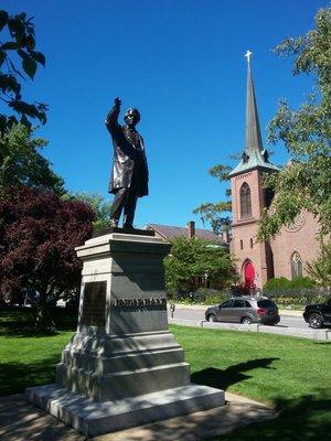 Alongside the capitol and a John P. Hall statue