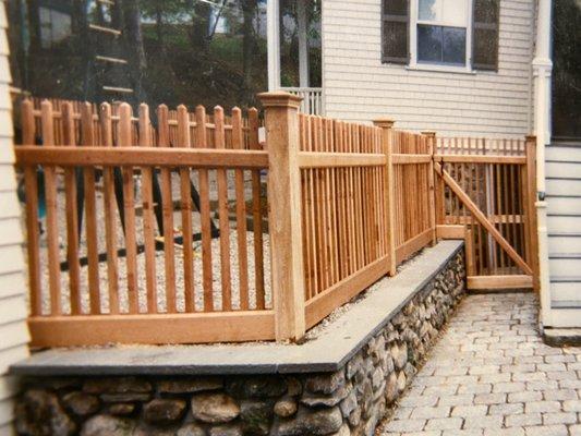 4' red cedar baluster and Custom gate built over wall