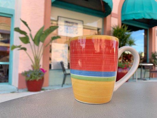 A cup of coffee on the sidewalk