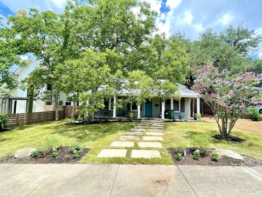 Limestone stepping pads; zoysia grass