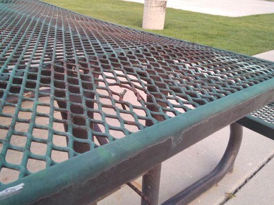 Picnic table sharp broken metal pieces sticking out.