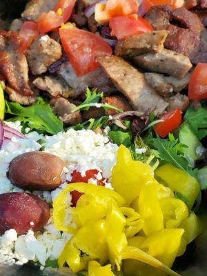 Gyro Plate - All beef Halal Gyro (Kosher), garnished w/tomatoes, red onions, pepperoncinis, side Greek salad, tzatziki & a pita. Delicious!